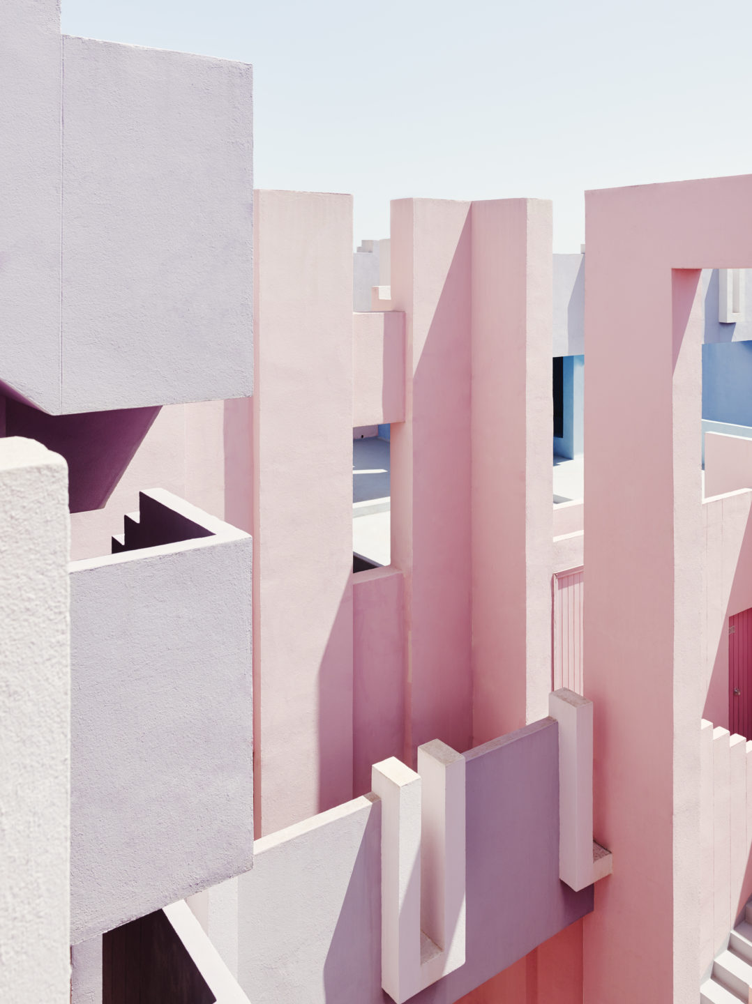 La Muralla Roja modern Spanish architecture designed by Ricardo Bofil. Pastel pink colourful building..